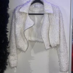 Small white two piece skirt and flizzy jacket w/ sheet inside so it’s not itchy